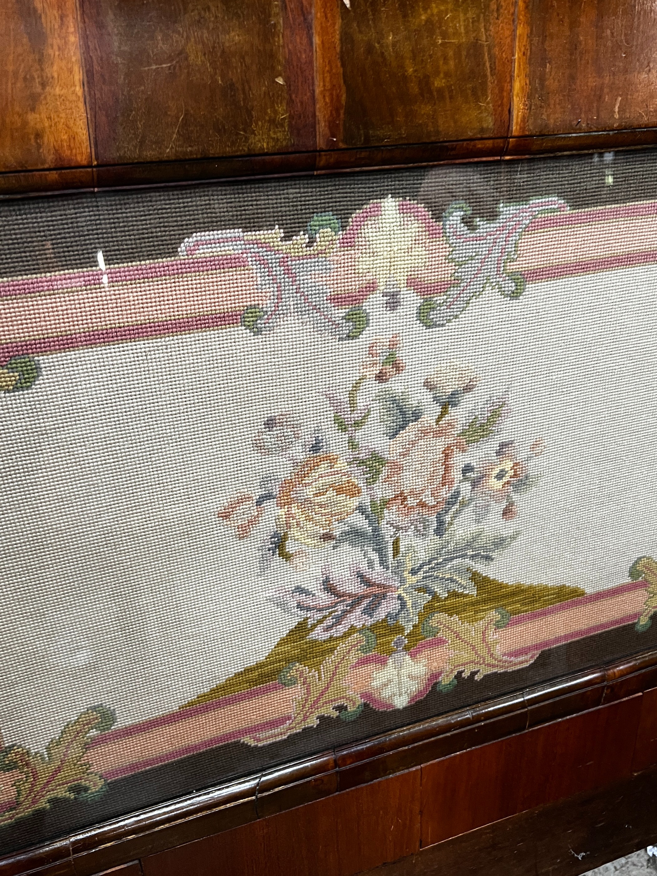 A Victorian rectangular walnut framed headboard with a floral tapestry panel, height 113cm